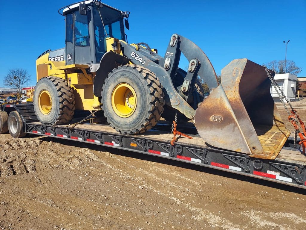 Wheel loader on trailer ready to be hauled