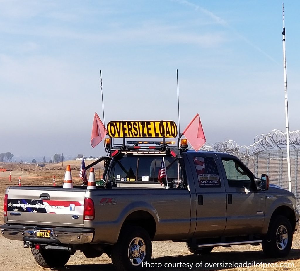 pilot car truck equipped with a height pole.