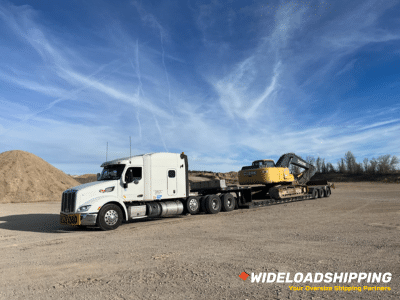 Transporting a John Deere 240D Hydraulic Excavator